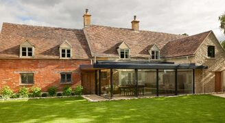 Frameless Glass Extension to Grade II Listed House - Old Mullions